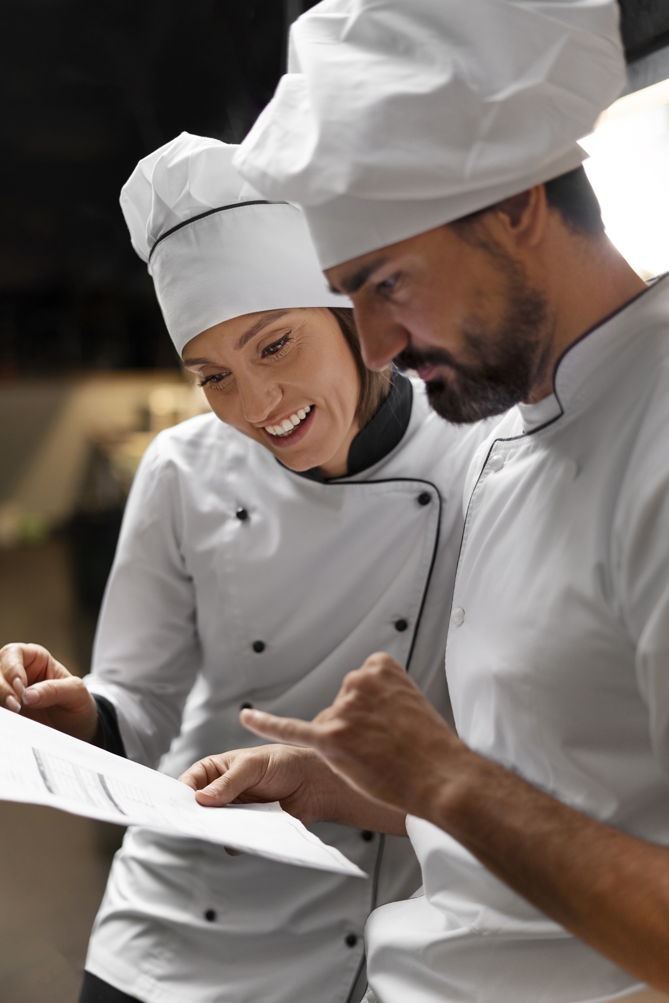 Chef cooking kitchen while wearing professional attire